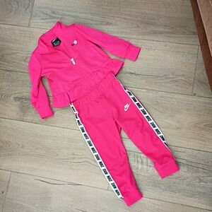 Nike toddler girls' tracksuit featuring a ruffly track jacket and matching pants
